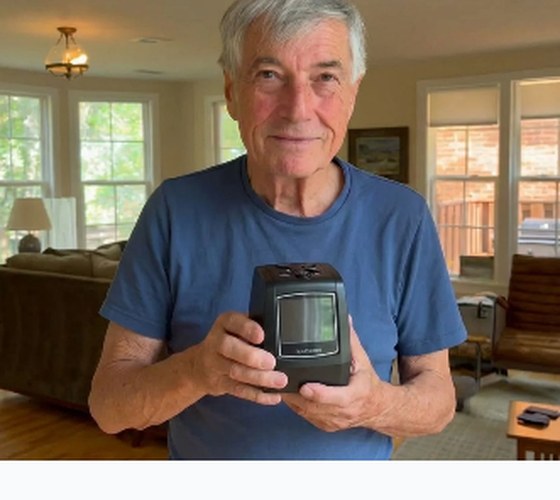 James holding MemoryVault Box